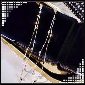 New long gold simulated diamond zircon stone chain tassel earrings